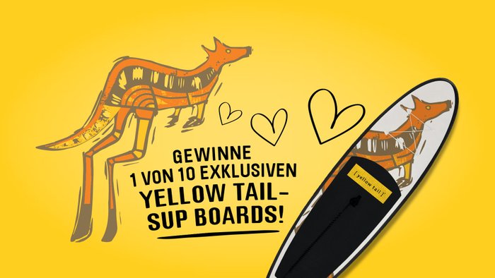 Ein orangefarbenes Känguru mit einem künstlerischen Design steht auf einem gelben Hintergrund, umgeben von Herzen.